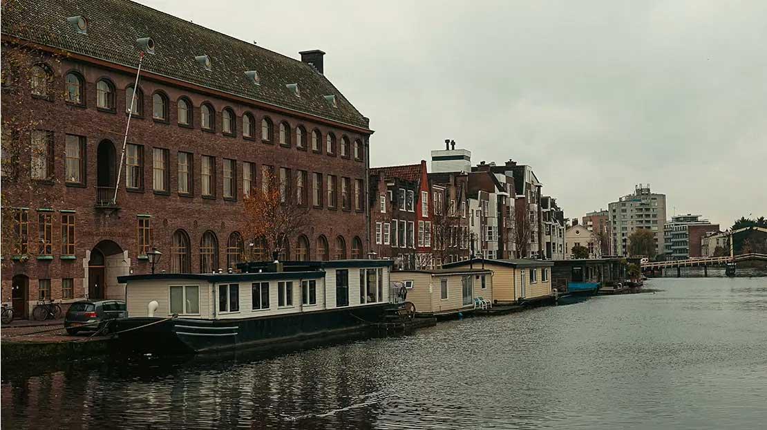 Exterior of dorm building along the canal.