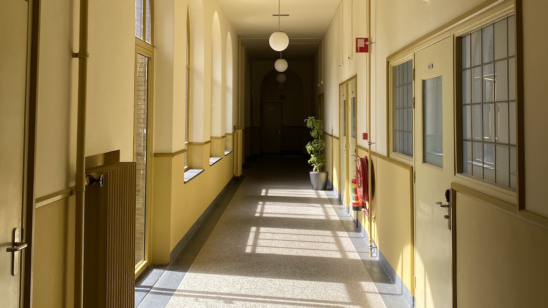 Long corridor leading to dorm rooms
